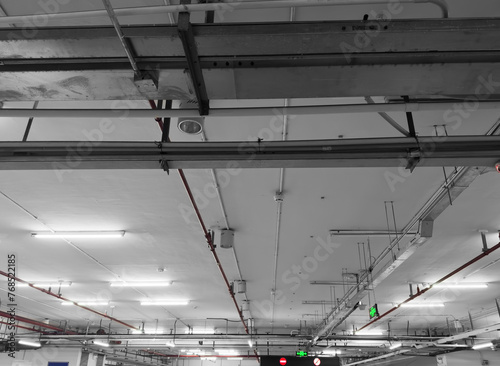 Lights and ventilation system in long line on ceiling of the industrial building. Exhibition Hall. Ceiling factory construction.