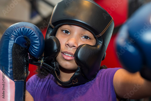 Young girls participating in a boxing clinic  at the local gym photo