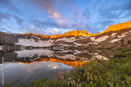 Mountains reflect in the water of Leavitt Lake photo