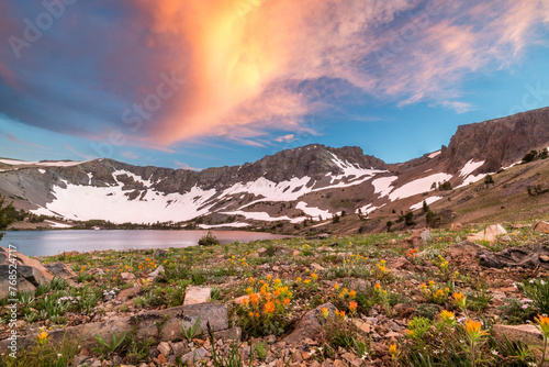 Colorful clouds over alpine lake photo