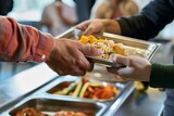 closeup of hands exchanging food tray in shelter cafeteria