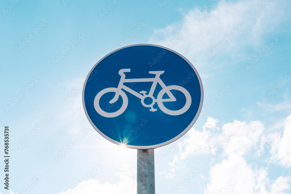 UK Road sign cycle  against a blue cloudy sky