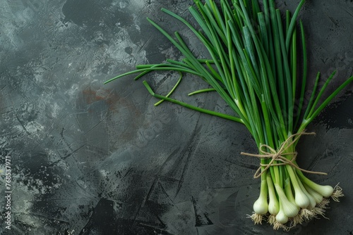 A group of green onions neatly arranged on a table from a top-down view