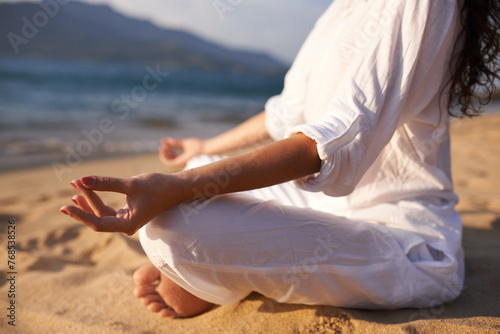 Yoga  hands and woman at beach in meditation for zen peace  wellness and mindfulness in outdoor nature. Lotus closeup  sand and calm person on holiday vacation for spiritual healing or mental health