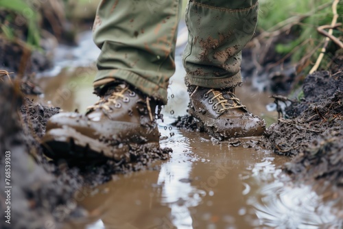 mudsplattered boots walking through puddles