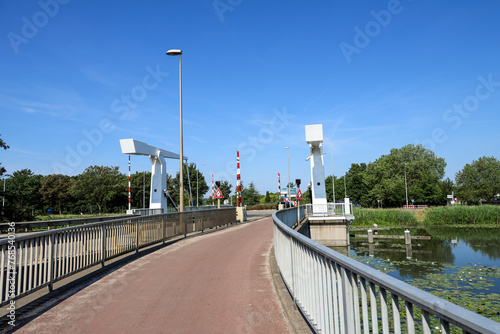 Bridges over the ring canal of the zuidplaspolder In the village of Nieuwerkerk aan den IJssel photo