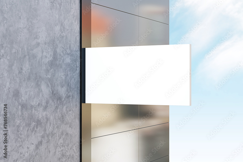 Sleek white sign mockup against a building facade. 3D Rendering Sleek white sign mockup against a building facade. 3D Rendering