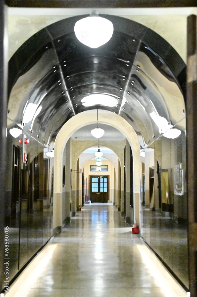 Arched beams & warm lights grace the elegant corridor of Taipei's New Culture Hall (once a Japanese police station, it's now a historical monument).
