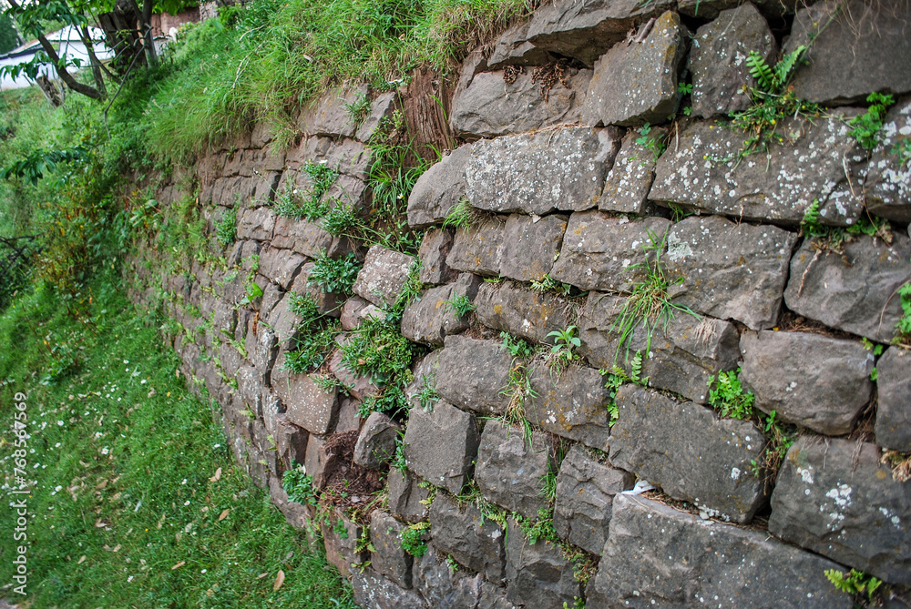 Stone wall with moss.