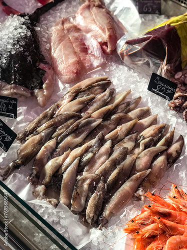 Assorted seafood on ice in a city market display case