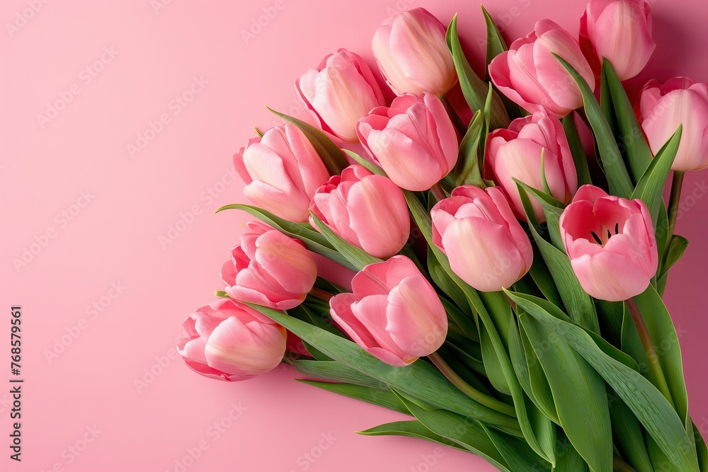 Mother's Day concept. Bouquet of pink delicate tulips on pink background, Top view, space for text Mother's Day concept. Bouquet of pink delicate tulips on pink background, Top view, space for text