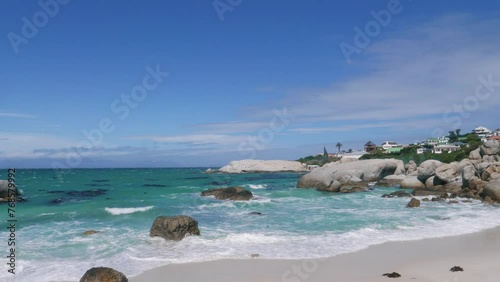 Panorama of Boulders Beach in South Africa. It is protected by granite boulders. Table Mountain National Park. A tropical paradise area with residential buildings on the shore