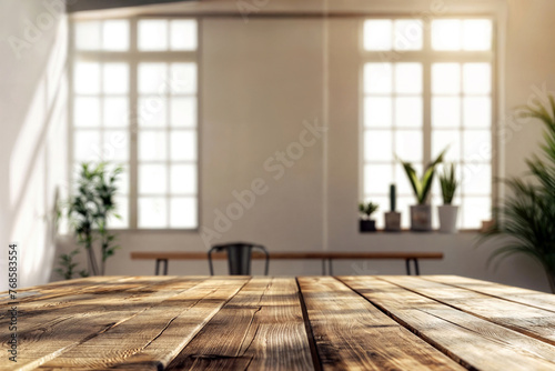 Empty wooden table and sunlight streaming through window panes, plants in background. Modern interior design with copy space for display or advertising. High quality photo