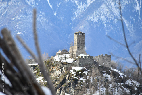 Graines Castle, above the town of Brusson, dominates the snow-capped valley photo