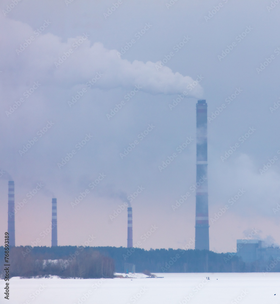 Smoke from the chimneys of a metallurgical plant in winter