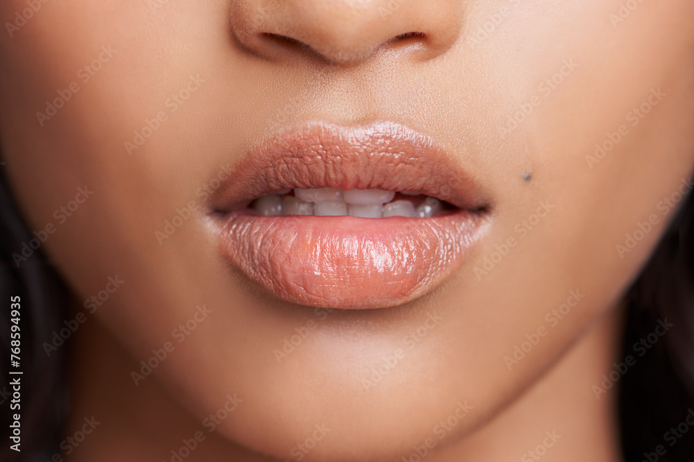 Fototapeta premium Closeup of woman, lips and skin with natural beauty, skincare and wellness with gloss for dermatology. Face, change and balm on mouth for moisturizer, cosmetic and collagen with oil or serum for glow