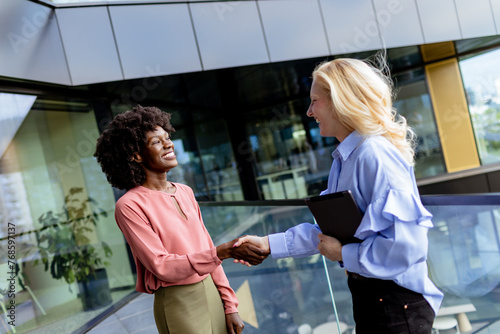 Two Professional Women Shar...