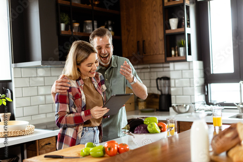 Cheerful couple stands in a...