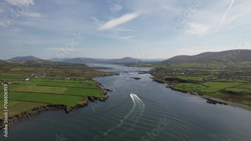 Drone video showing a boat sailing towards the town of PortMagee in Kerry Ireland photo