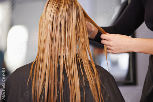 Woman, hairstylist and hair care in salon, back and keratin treatment or dye for grooming. Female person, beauty professional and makeover transformation at hairdresser, cosmetics and pamper client