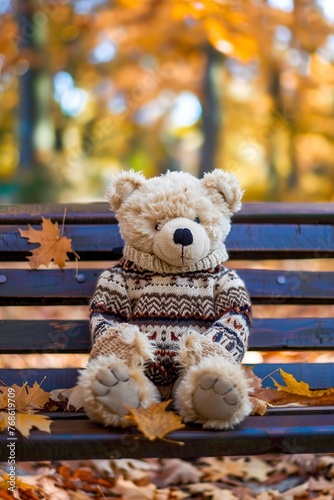 Teddy Bear Sitting on Bench in Park