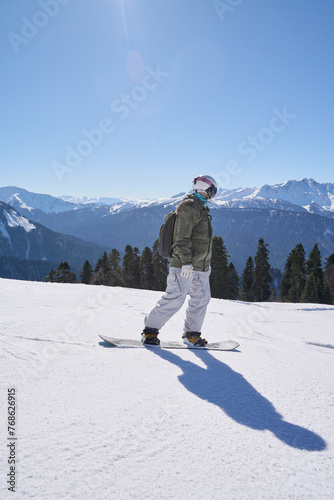 A snowboarder enjoys the descent