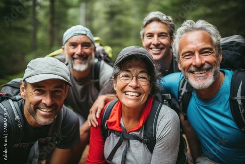 A diverse group of senior hikers resting on a trail, surrounded by nature, showcasing their love for outdoor activities and the serene beauty of their surroundings. © Regina