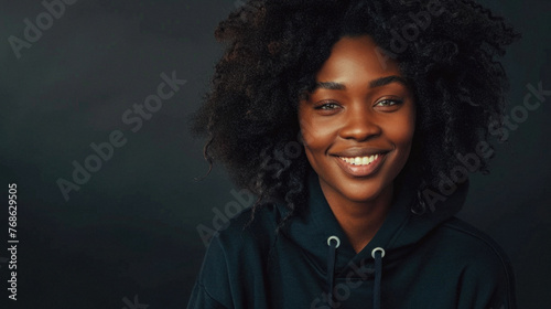Happy african american woman in black hoodie