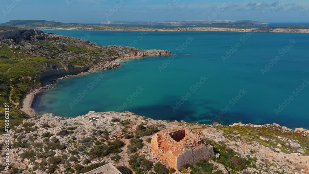 Beach on Malta island. Turquoise seaside cliff coast bay Mediterranean Sea. Medieval ruin Beach on Malta island. Turquoise seaside cliff coast bay Mediterranean Sea. Medieval ruin