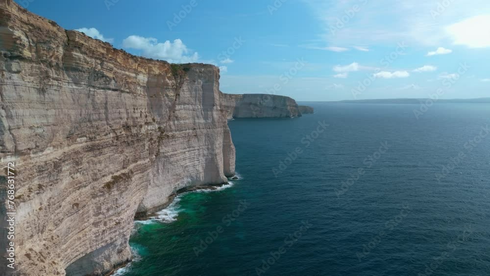 Cliff on Malta Gozo island. Turquoise seaside steep coast Mediterranean Sea. Aerial drone Cliff on Malta Gozo island. Turquoise seaside steep coast Mediterranean Sea. Aerial drone