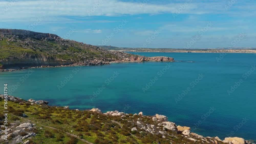 Beach on Malta island. Turquoise seaside cliff coast bay Mediterranean Sea. Aerial drone Beach on Malta island. Turquoise seaside cliff coast bay Mediterranean Sea. Aerial drone
