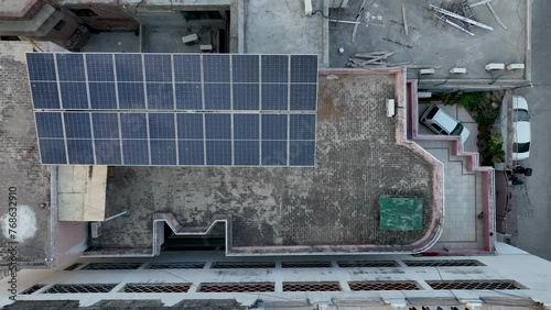 Drone flight from a building in Gujranwala with photovoltaics on the roof - Punjab photo