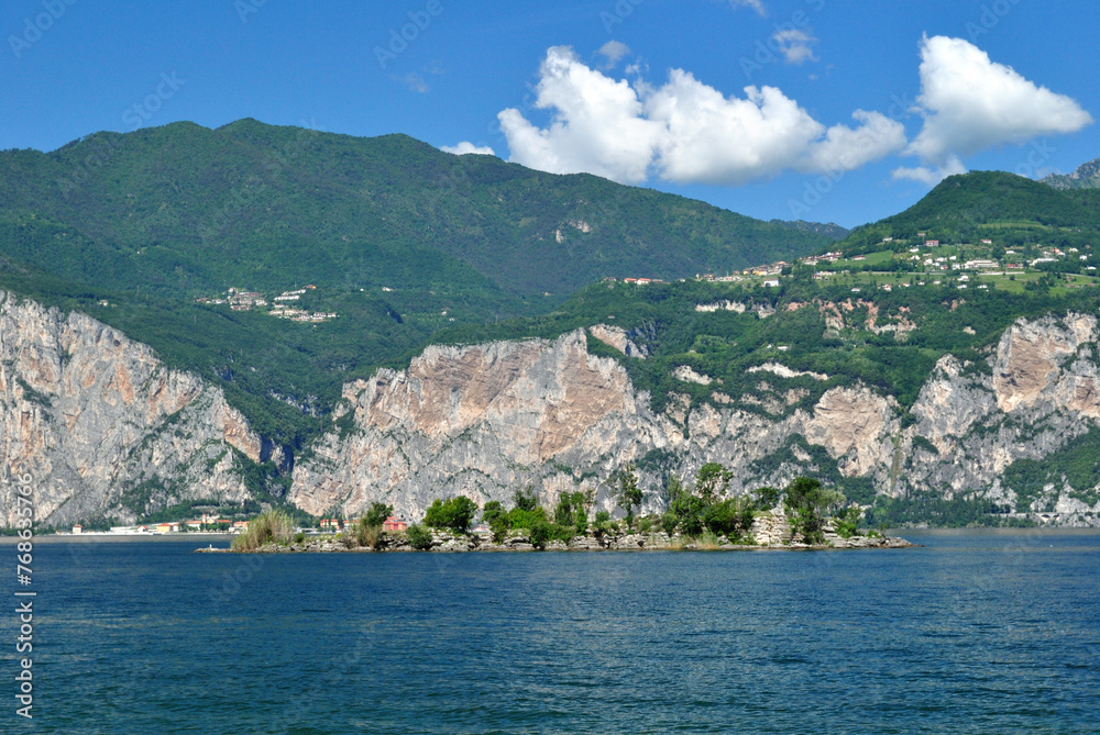 View of Lake Garda with Tree Lined Shore and Mountains