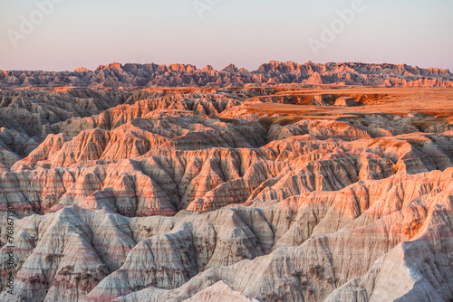The beautiful Badlands National Park in South Dakota with sunset view in the background photo