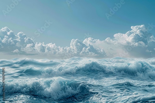 Majestic Ocean Waves with Fluffy Clouds on the Horizon Under Blue Sky © pisan