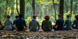 A group of people are meditate in a forest