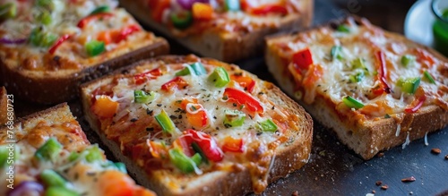 Cheesy and veggie-covered sliced toast  known as pizza toast.