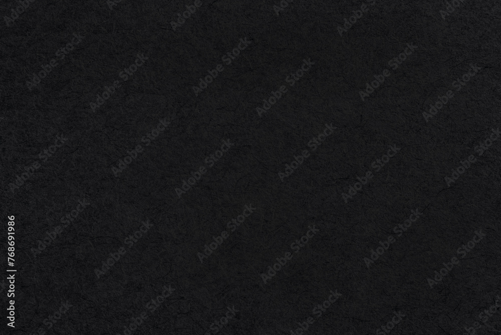 black coarse paper macro background