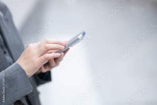 Close-up of professional woman using mobile phone
