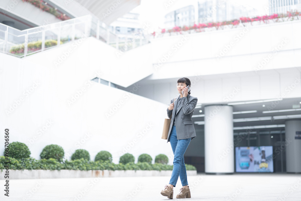 Professional woman walking to work Professional woman walking to work