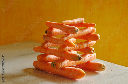 stack of carrots with beautiful lighting, healthy eating, dieting,springtime vegetable concept, free copy space