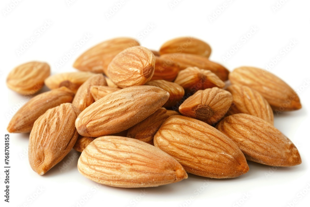 Close-up of Natural and Healthy Almonds Isolated on White Background. Brown Nutrient Rich Almonds for Nature Inspired Food Concept Close-up of Natural and Healthy Almonds Isolated on White Background. Brown Nutrient Rich Almonds for Nature Inspired Food Concept