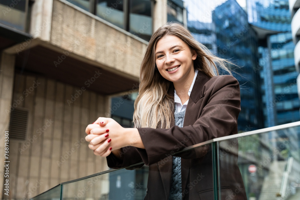Obraz premium Happy business women portrait of young female urban professional businesswoman in suit standing outside office building cross-armed. Confident successful project leader, financial company owner