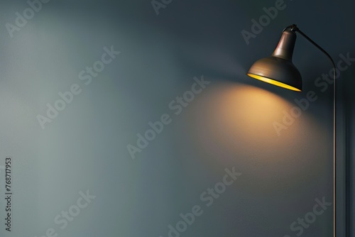 Gray wall with lighting from a metal gold lamp. Modern universal for presentation background 