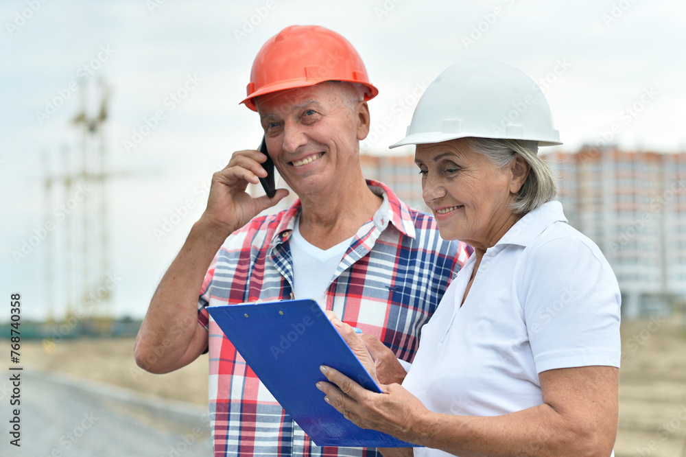 Portrait of senior couple in under construction Portrait of senior couple in under construction