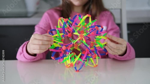 herapeutic sensory activities for children's hands, neuropsychology, orthopedic correction. Child performs an exercise for tactile sensations on hand motor skills. Selective focus.	 photo