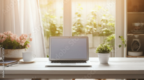 Laptop computer with blank screen on wooden table in home office . © Synthetica