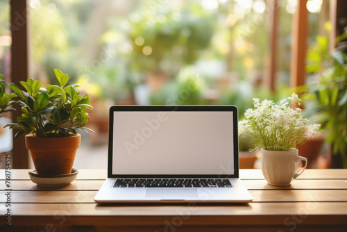 Mockup image of laptop with blank white screen on wooden table in cafe © Synthetica