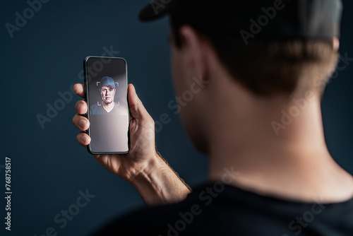 Face recognition with facial scan in phone. Identification and verification to unlock smartphone. Deep fake technology. Man using cellphone. AI mobile tech and biometric id authentication. Data access
