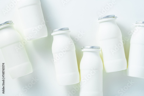 drinking yogurt with probiotic in bottles on white
